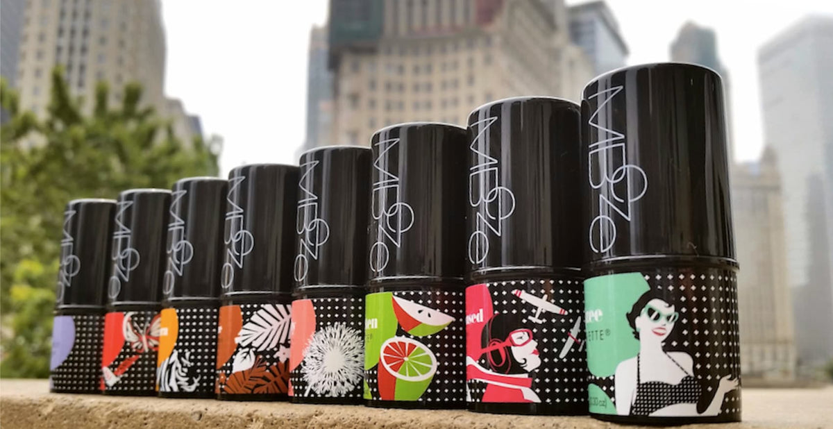 All 8 MBeze Deodorettes in front of the Chicago cityscape on the Michigan Ave bridge that crosses the Chicago River in downtown Chicago.